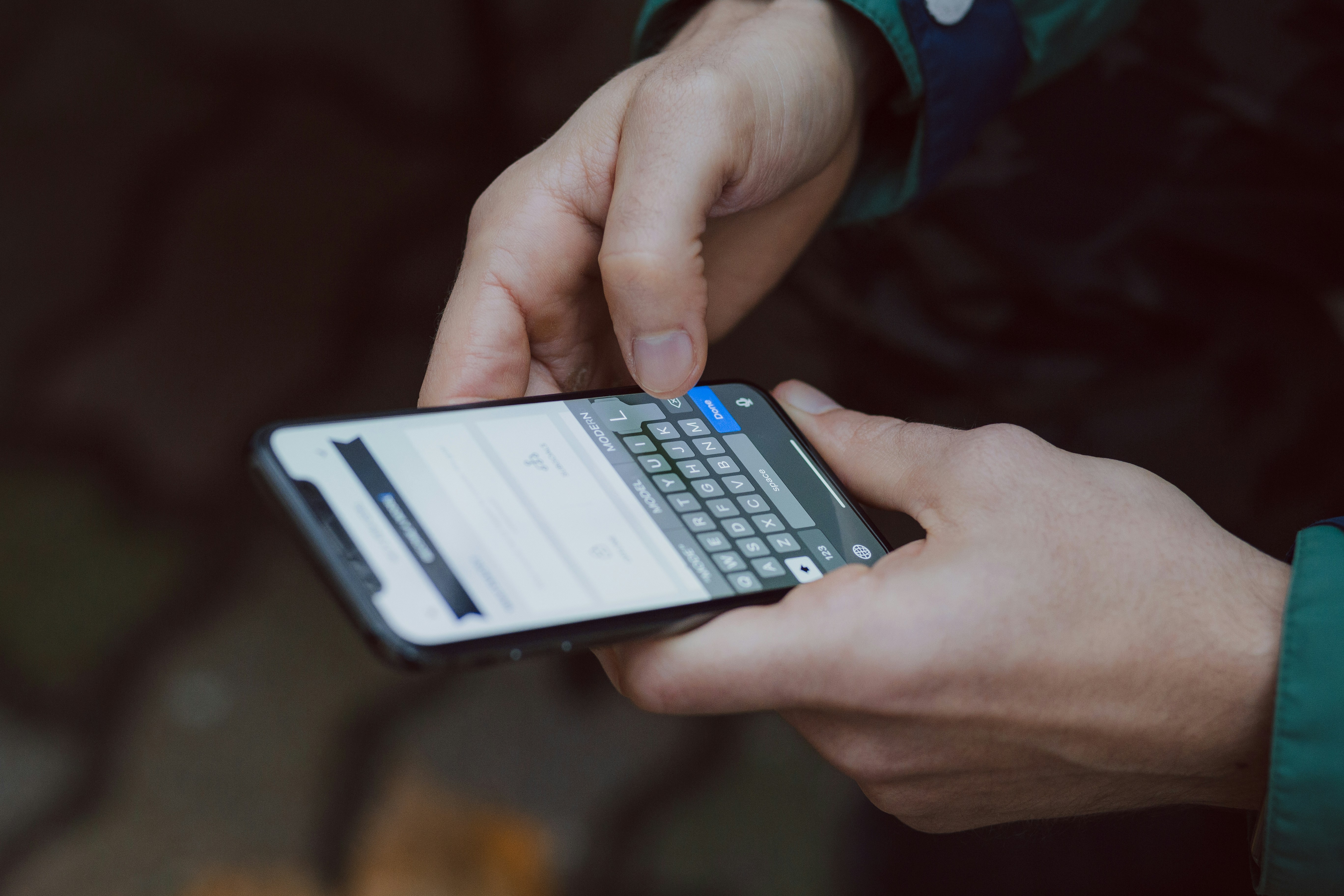 Person filling out a form on a smartphone